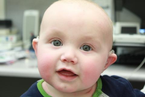 Wyatt  with his hearing aids hearing for the first time