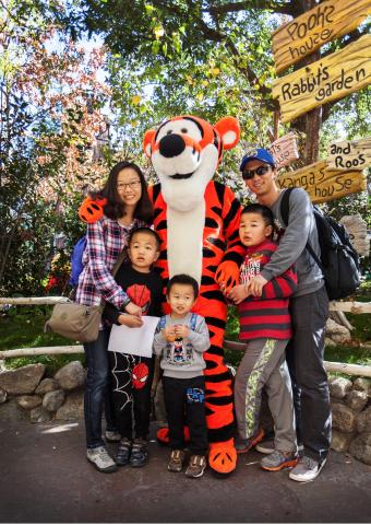Mike's family with Tigger at Disneyland. 