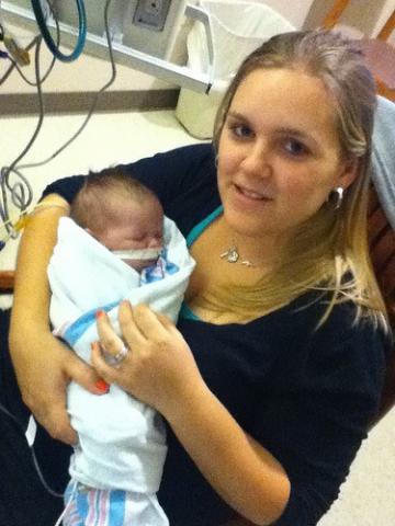 A picture of Ruth holding her newborn son Corbin who passed away due to CCHD