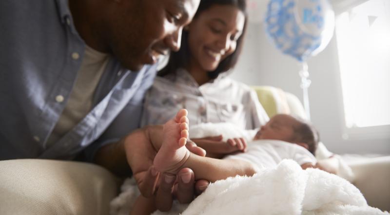 new born baby with parents